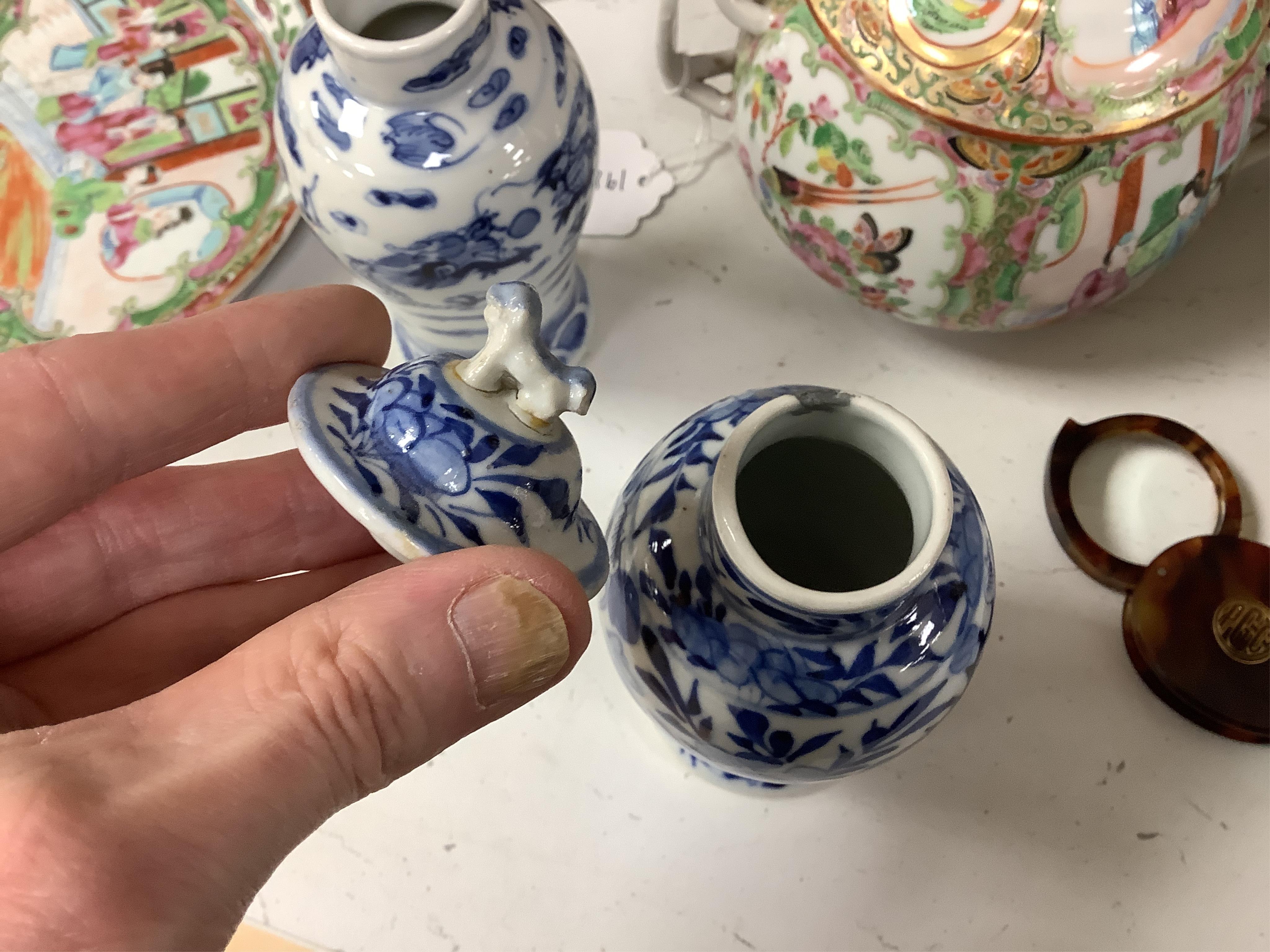 A collection of 19th century Chinese porcelain to include a pair of famille rose candlesticks, dish and a pair of blue and white baluster vases and covers